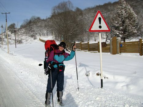 The girl, the tourist, travel, productive leisure, the nature, winter, snow, a campaign, caucasus, idea, a smile, settlement, road, wood, a kind, a sign, the index, a fence, equipment, a hill, mountains