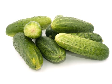 Fresh tasty cucumbers on white background