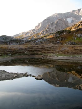 The nature; caucasus; mountains; top; a ridge; a panorama; a landscape; lake; water; a reservoir; peaks; the sky; reflexion; rocks; the bright; a background; a kind; beauty; reserve; morning, stones, a bottom, a glacier, snow