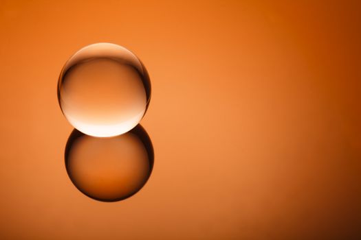 Minimalist crystal ball floating on a vignetted gradient