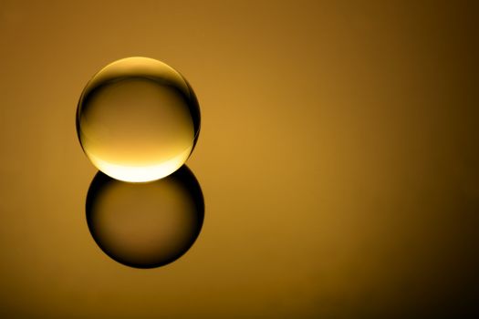 Minimalist crystal ball floating on a vignetted gradient