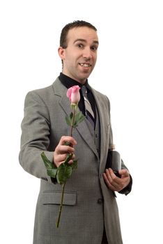 A man wearing a suit and tie, holding a rose and a bottle of champagne, isolated against a white background