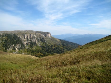 Mountains, caucasus, rocks, a relief, a landscape, wood, the nature, a panorama, a landscape, a ridge, top, breed, the sky, reserve, a background, a kind, a structure, trees, a slope, beauty, bright, a file, clouds, a grass, the Alpine meadows, tourism, travel, rest, gorge, a canyon