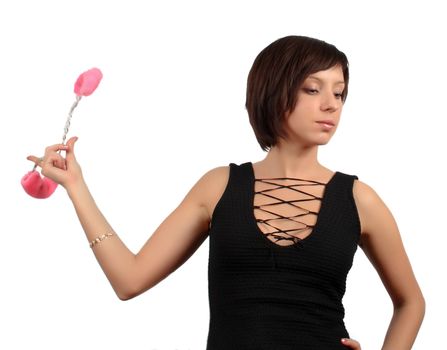 dark haired girl with handcuffs isolated over white