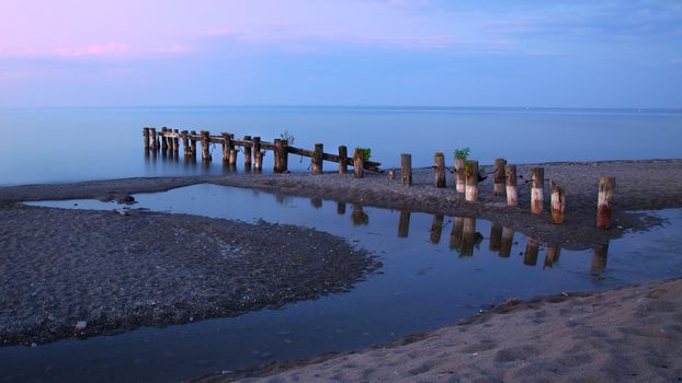 Pier, tidepool and Lake Ontario in evening