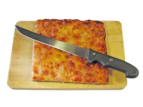 Slice of pizza on a cutting board with knife