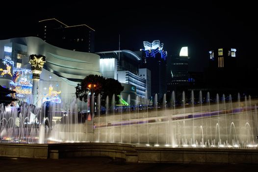 shanghai fountainilluminated by colorfull light by night