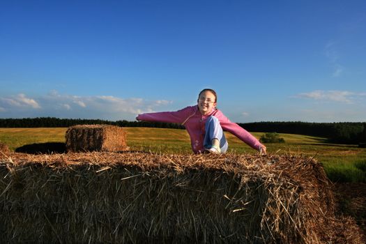 Girl having fun in grain field