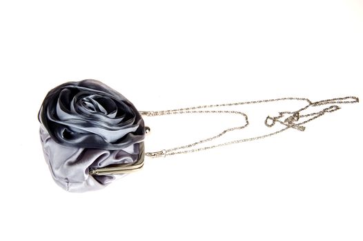 a silver handbag on a white background