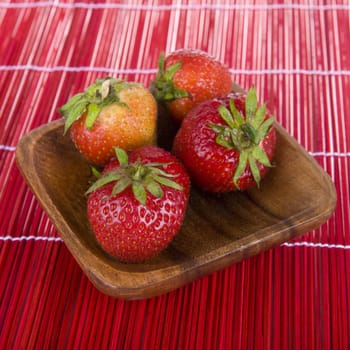 strawberries in a wooden tray