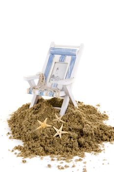 sand with a beach chair and seastars