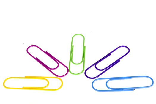 five colorful paperclips on a white background