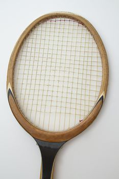 Close-up on the head of a vintage wood tennis racket