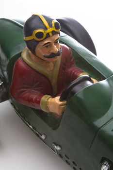 vintage toy race car with mustache driver