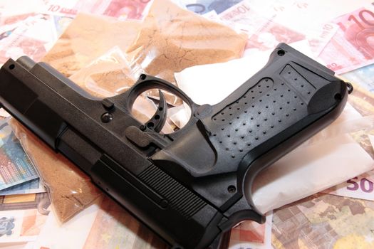 gun drugs and money showing a dangerous side to life