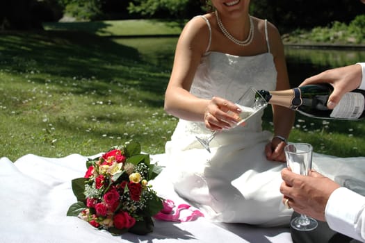 Wedding couple having champangne