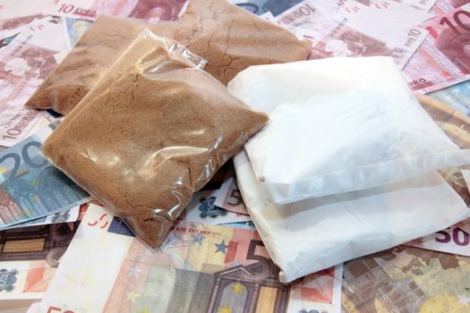 a stash of drugs and money showing a high cost to life