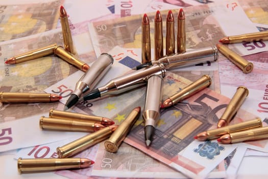 bullets and money showing a dangerous side to life