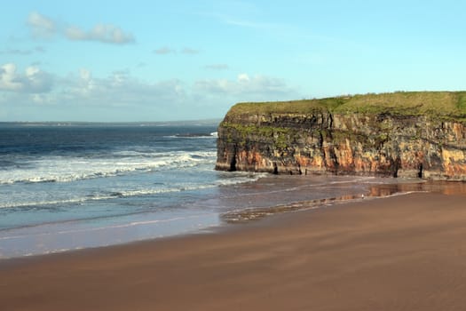 the waves crashing in on ballybunion beach ireland