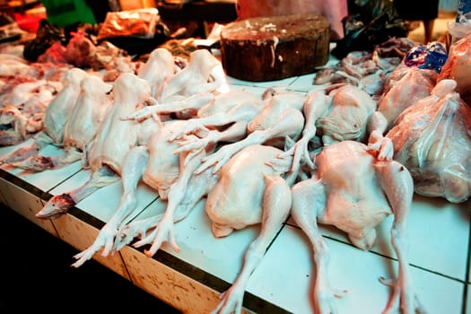Fresh raw chicken at a butcher