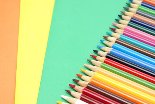 A colorful image of pencil crayons and paper.