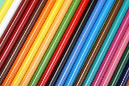 A colorful background made from a macro shot of pencil crayons.