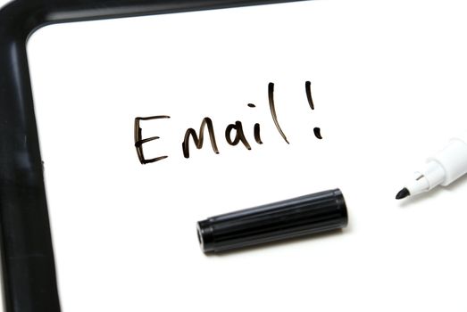 The word Email is hand written in black marker on an office whiteboard.