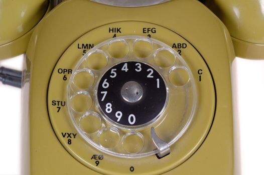 Green retro telephone taken on clean white background.