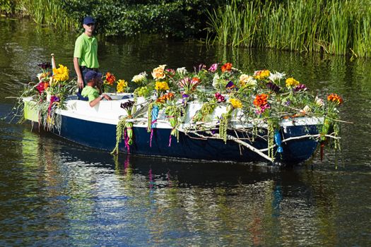 VLAARDINGEN, THE NETHERLANDS - JULI 2010: Beautiful flower boats in the unique annual Westland Floating Parade Juli 30, 2010, Vlaardingen, the Netherlands.

