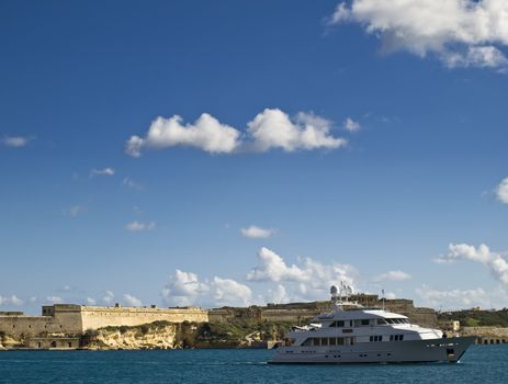 A pleasure vessel enters the Grand Harbour in Malta