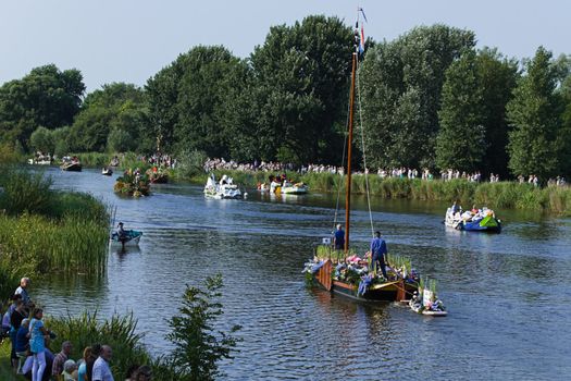 VLAARDINGEN, THE NETHERLANDS - JULI 2010: Beautiful flower boats in the unique annual Westland Floating Parade Juli 30, 2010, Vlaardingen, the Netherlands.

