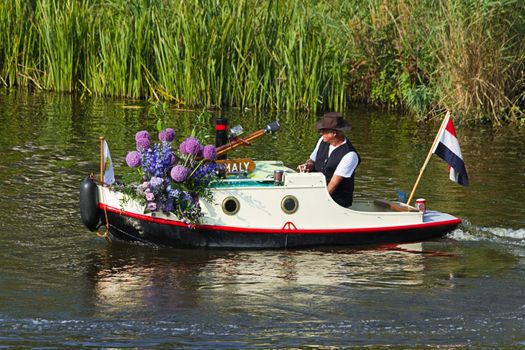 VLAARDINGEN, THE NETHERLANDS - JULI 2010: Beautiful flower boats in the unique annual Westland Floating Parade Juli 30, 2010, Vlaardingen, the Netherlands.

