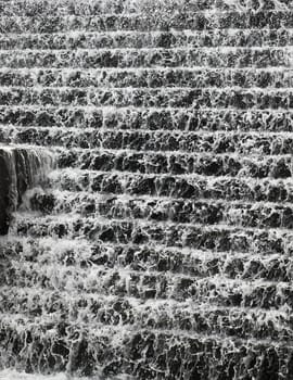 Water flowing down a terraced wall in Chadwick Lakes in Malta