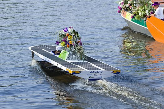 VLAARDINGEN, THE NETHERLANDS - JULI 2010: Beautiful flower boats in the unique annual Westland Floating Parade Juli 30, 2010, Vlaardingen, the Netherlands.

