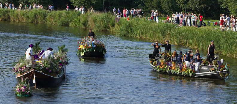 VLAARDINGEN, THE NETHERLANDS - JULI 2010: Beautiful flower boats in the unique annual Westland Floating Parade Juli 30, 2010, Vlaardingen, the Netherlands.

