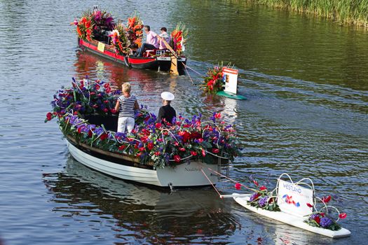 VLAARDINGEN, THE NETHERLANDS - JULI 2010: Beautiful flower boats in the unique annual Westland Floating Parade Juli 30, 2010, Vlaardingen, the Netherlands.

