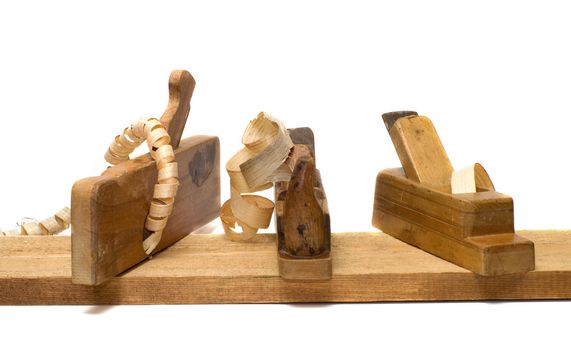 Three old planer on the board isolated on a white background.