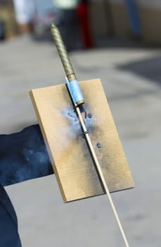 a man launching fireworks rockets with his hands