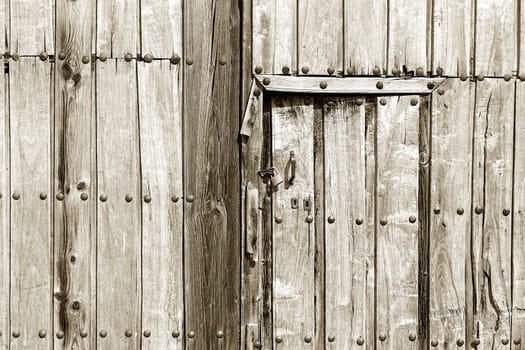 an old vintage wooden door in a spanish village