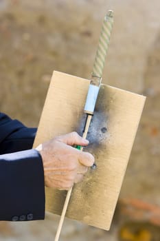 a man launching fireworks rockets with his hands