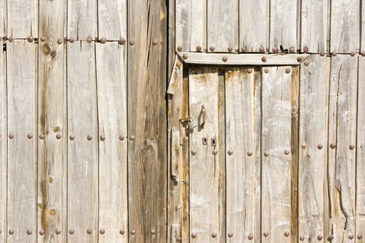 an old vintage wooden door in a spanish village