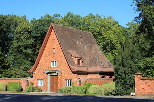 house red and trees green