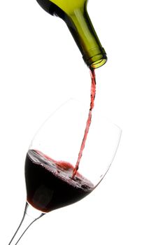 a clear glass of red wine isolated on white background