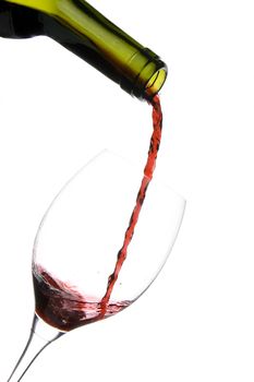 a clear glass of red wine isolated on white background