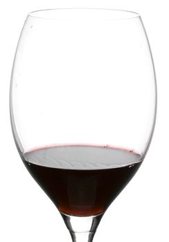 a clear glass of red wine isolated on white background