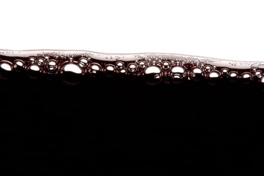 a clear glass of red wine isolated on white background