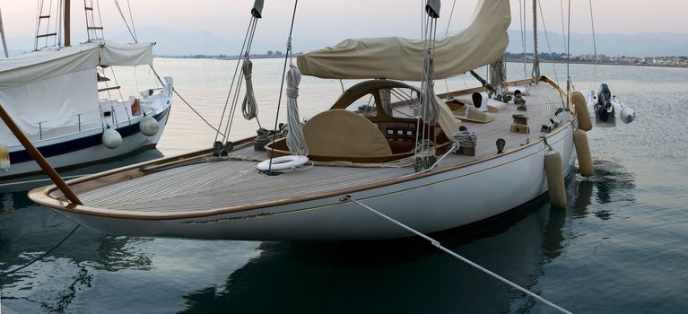 luxury yacht in a dock of a village in greece