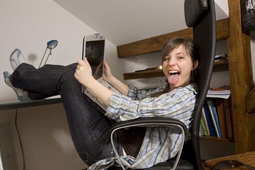 Young woman looks at her notebook