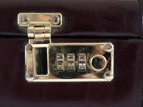 Isolated view of a combination lock in a closed and locked position