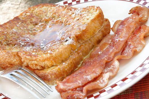 French toast with a side of bacon.